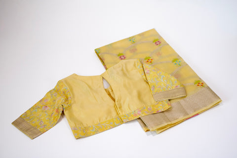 Yellow Chiniya Silk Saree with Pastel Floral Motifs and Zari Border