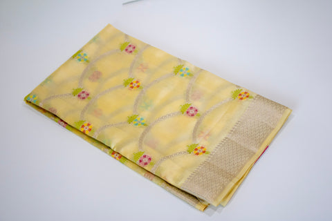 Yellow Chiniya Silk Saree with Pastel Floral Motifs and Zari Border