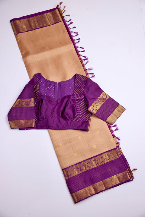 Beige body with golden motifs with rich purple Border Kanchipattu Saree