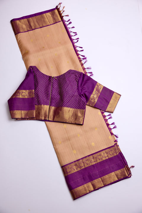 Beige body with golden motifs with rich purple Border Kanchipattu Saree