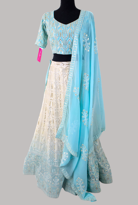 Traditional blue and cream lehenga with a blue embroidered dupatta 